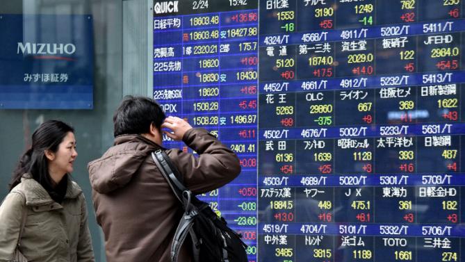 Asian Shares Close Broadly Higher as Dollar Slightly Weakens