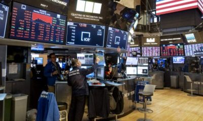 US markets give back ground