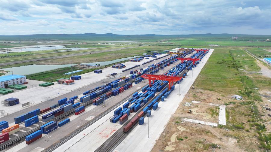 An aerial drone photo shows containers being loaded at Manzhouli Railway Port in north China's Inner Mongolia Autonomous Region