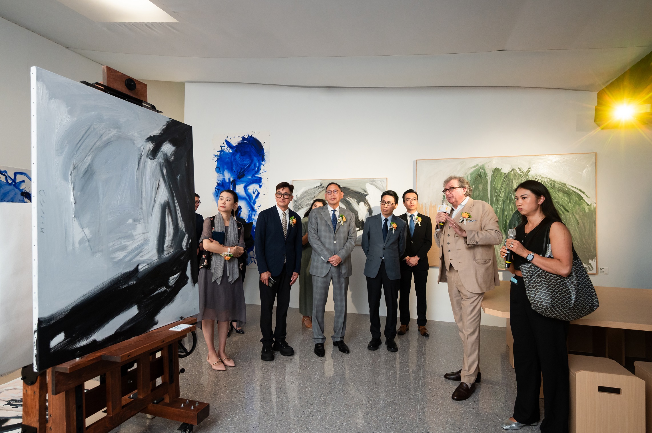 Curator of the exhibition and artist Bruno Moinard walked guests of honor through a personal tour of his eponymous exhibition at GalaxyArt.