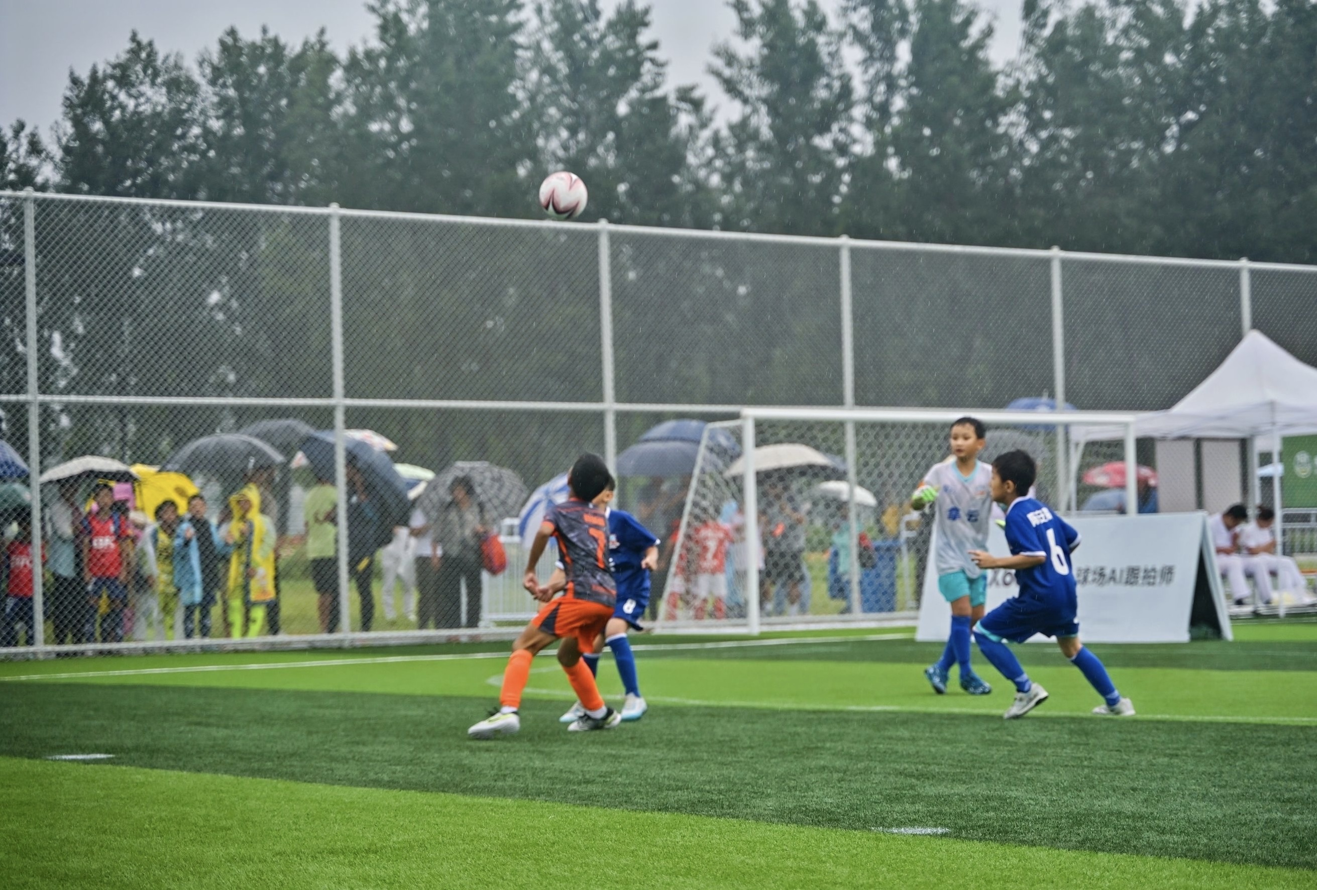 Players vie for the ball during a Baidu Cup match, August 2025.